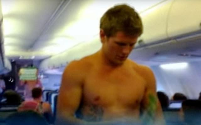 Shirtless Rugby Stud Explains In-Flight Safety