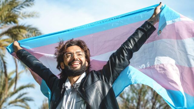 Happy man with transgender flag