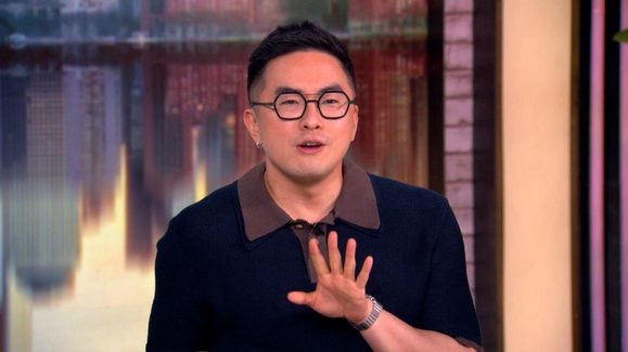 Bowen Yang hilariously calls Vice President JD Vance a 'pope killer' during a 'View' interview while promoting his new film 'The Wedding Banquet' and discussing his viral 'SNL' impressions.