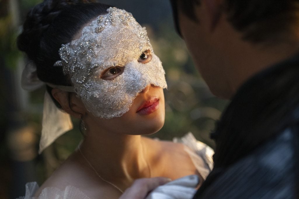Sophie Beckett looks up at Benedict in a lace mask