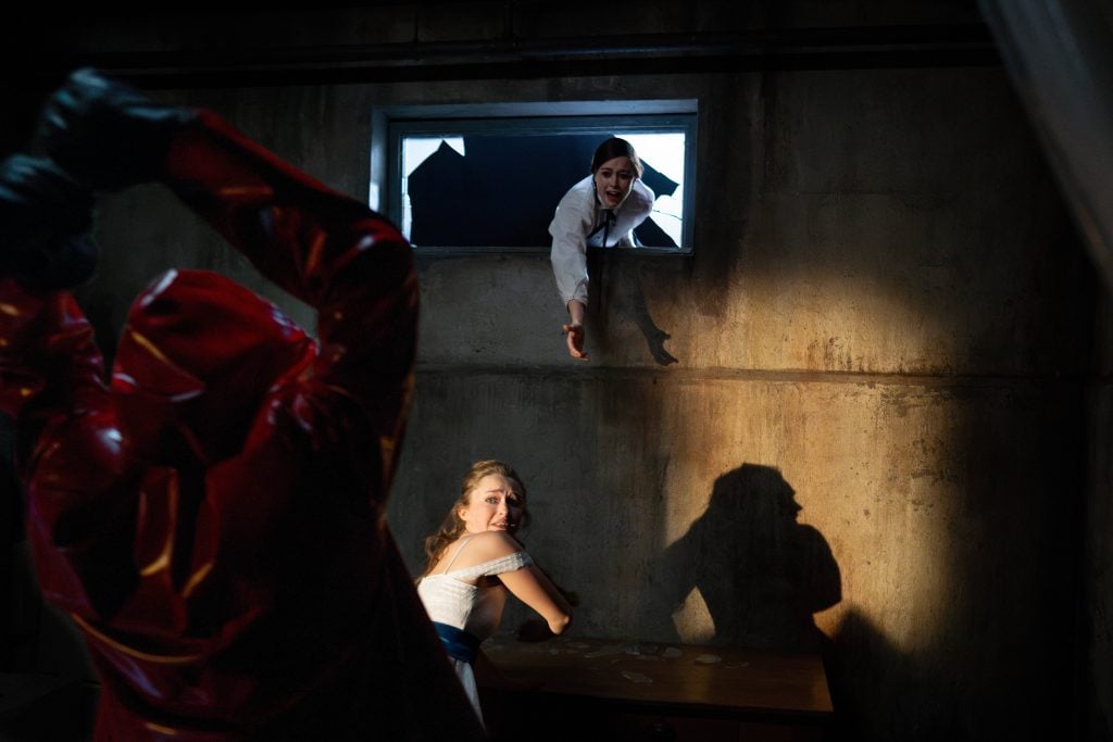 Fear Street: Prom Queen. (L-R) The Killer, India Fowler as Lori Granger and Suzanna Son as Megan Rogers in Fear Street: Prom Queen.