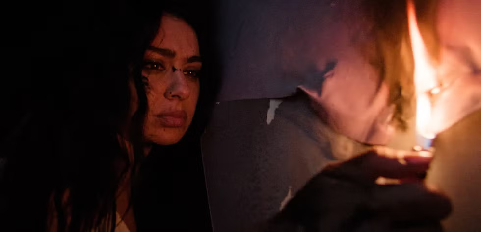 Charli XCX burning the billboard of herself after splattering paint all over it. Photo: Atlantic Records/Charli XCX