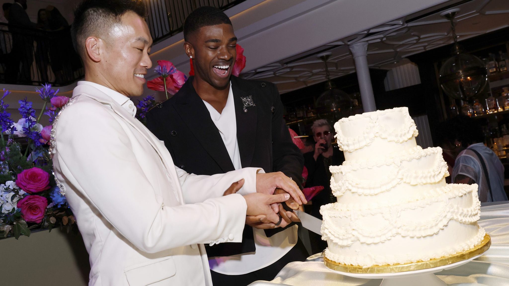 WASHINGTON, DC - MAY 30: (L-R) Barry Hoy and Teraj Allen celebrate their marriage as Them and Destination DC kick off World Pride 2025 at Succotash on May 30, 2025 in Washington, DC.