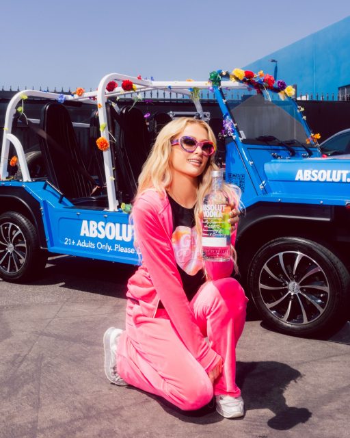 Paris Hilton catches a ride to OUTLOUD Music Festival in the Absolut PRIDE Moke. Photo: Ashley Osborn