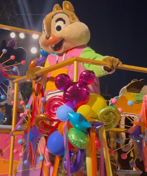 Chip on a parade float at Disneyland's Pride Nite Celebration