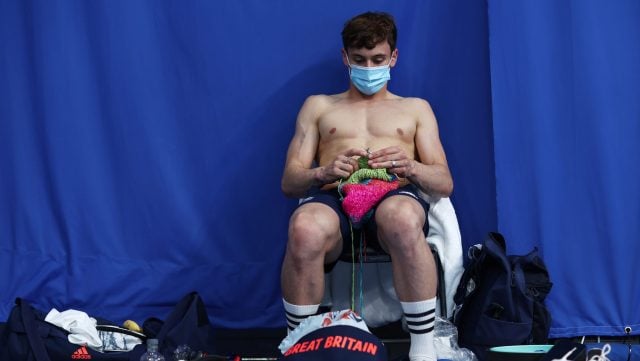 Thomas Daley of Team Great Britain is seen knitting before the Men's 10m Platform Final on day fifteen of the Tokyo 2020 Olympic Games at Tokyo Aquatics Centre on August 07, 2021 in Tokyo, Japan.