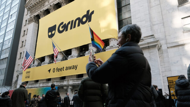 The LGBTQ social networking platform Grindr puts on a public show outside of the New York Stock Exchange (NYSE) as the company goes public following its merger with special purpose acquisition company (SPAC) Tiga Acquisition Corp. on November 18, 2022 in New York City. Trading under the ticker symbol "GRND," the stock surged in morning trading.