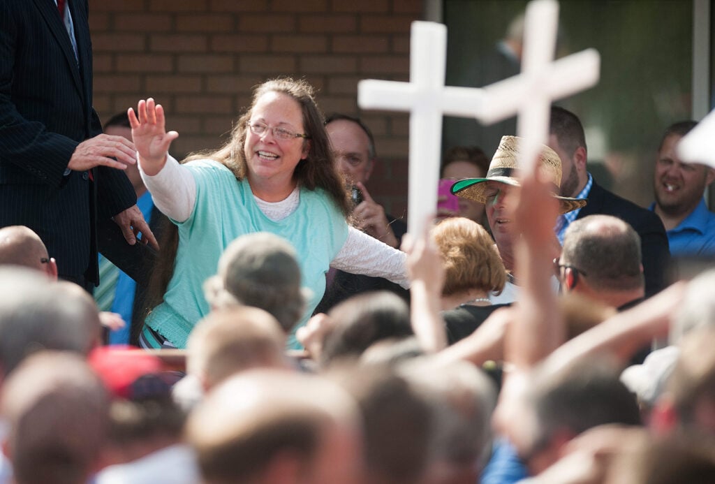 GRAYSON, KY - SEPTEMBER 8:   Rowan County Clerk of Courts Kim Davis waves to a crowd of her supporters at a rally in front of the Carter County Detention Center on September 8, 2015 in Grayson, Kentucky. Davis was ordered to jail last week for contempt of court after refusing a court order to issue marriage licenses to same-sex couples. (Photo by Ty Wright/Getty Images)