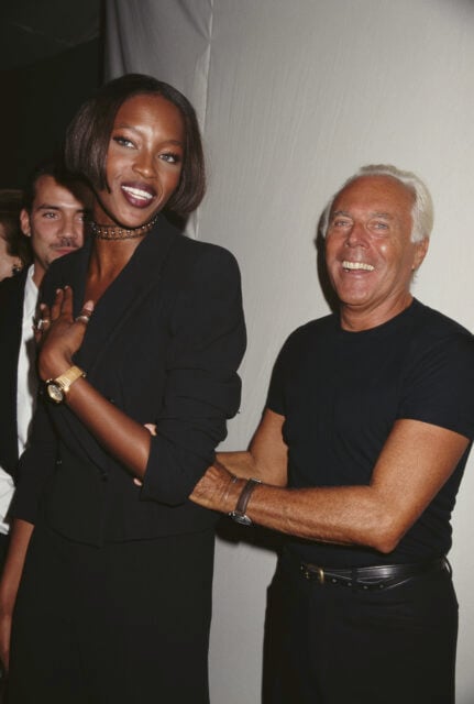 Italian fashion designer Giorgio Armani and English model Naomi Campbell attend a private party, 1996.