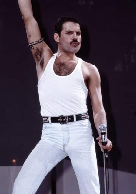 Freddie Mercury of Queen performs on stage at Live Aid at Wembley Stadium on 13th July 1985 in London.
