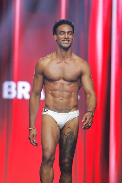 The men of Mister Global 2025 walk the stage for the swimsuit category in Thailand.