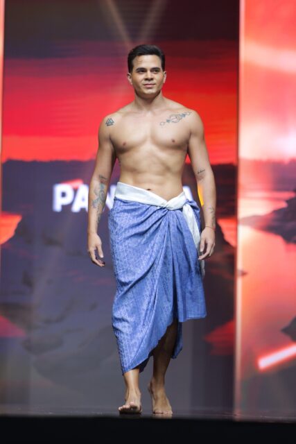 The men of Mister Global 2025 walk the stage in traditional Thai attire.