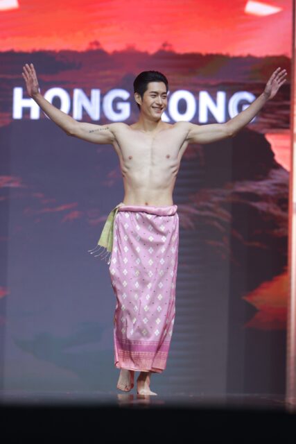 The men of Mister Global 2025 walk the stage in traditional Thai attire.