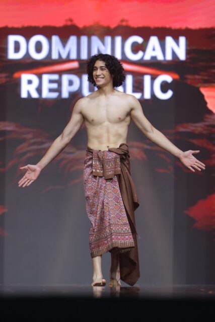 The men of Mister Global 2025 walk the stage in traditional Thai attire.