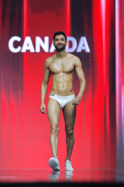 The men of Mister Global 2025 walk the stage for the swimsuit category in Thailand.