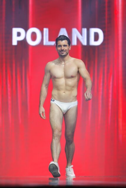 The men of Mister Global 2025 walk the stage for the swimsuit category in Thailand.