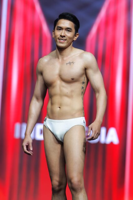 The men of Mister Global 2025 walk the stage for the swimsuit category in Thailand.