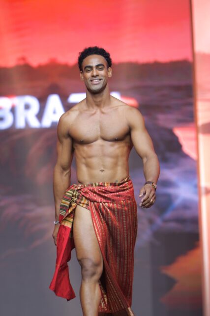 The men of Mister Global 2025 walk the stage in traditional Thai attire.