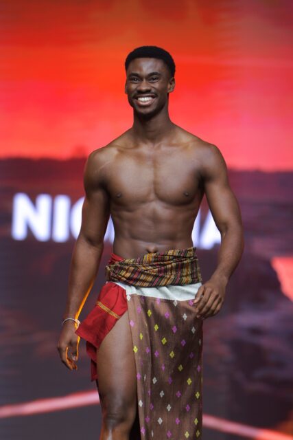 The men of Mister Global 2025 walk the stage in traditional Thai attire.