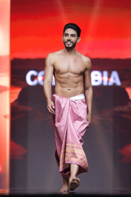 The men of Mister Global 2025 walk the stage in traditional Thai attire.