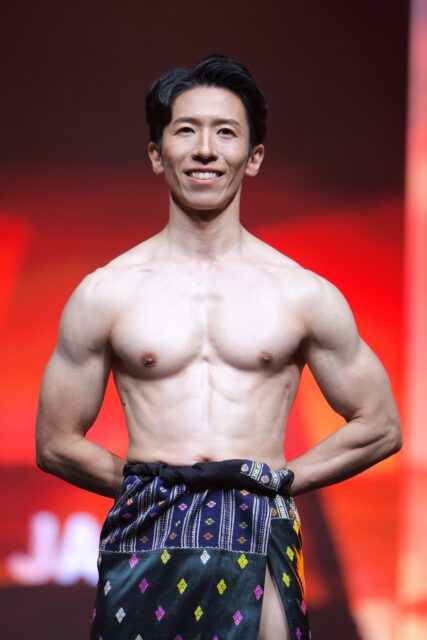The men of Mister Global 2025 walk the stage in traditional Thai attire.