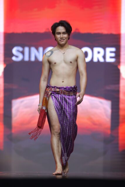 The men of Mister Global 2025 walk the stage in traditional Thai attire.