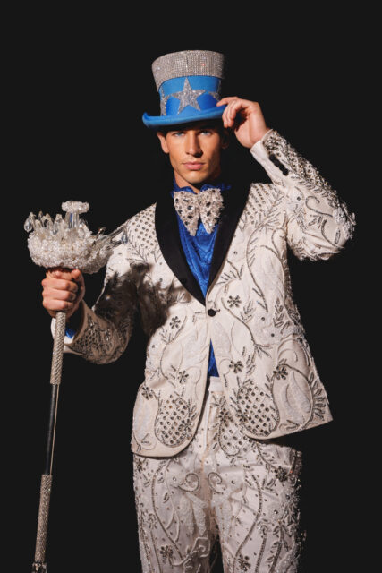 The men of Mister Global 2025 dressed in costume celebrating their unique cultural heritage.