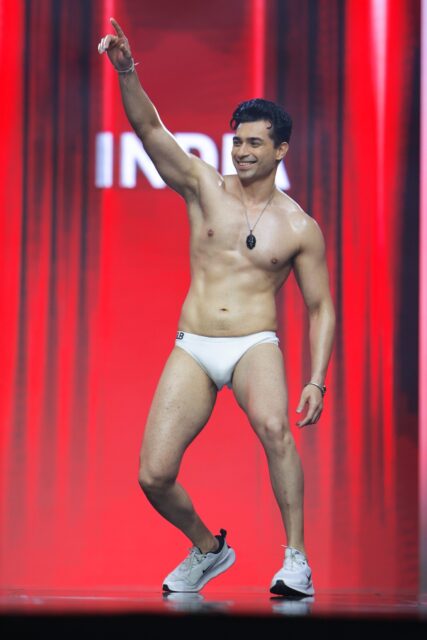 The men of Mister Global 2025 walk the stage for the swimsuit category in Thailand.