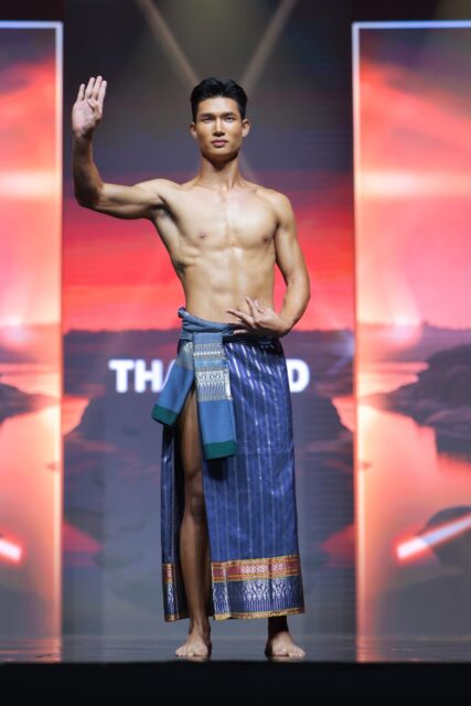 The men of Mister Global 2025 walk the stage in traditional Thai attire.