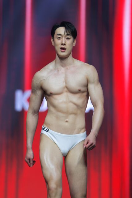 The men of Mister Global 2025 walk the stage for the swimsuit category in Thailand.