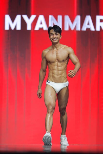 The men of Mister Global 2025 walk the stage for the swimsuit category in Thailand.