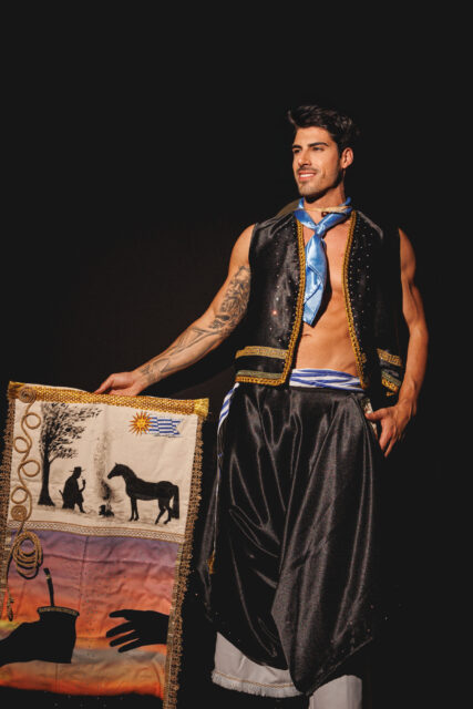 The men of Mister Global 2025 dressed in costume celebrating their unique cultural heritage.