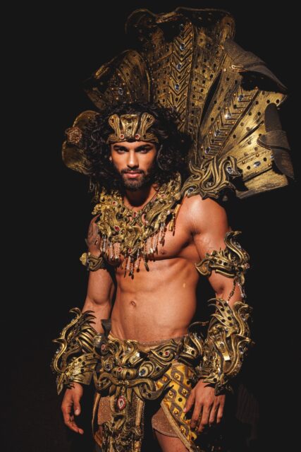 The men of Mister Global 2025 dressed in costume celebrating their unique cultural heritage.