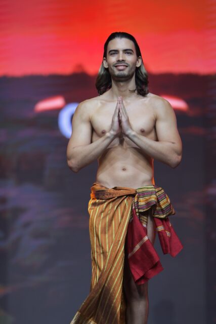 The men of Mister Global 2025 walk the stage in traditional Thai attire.