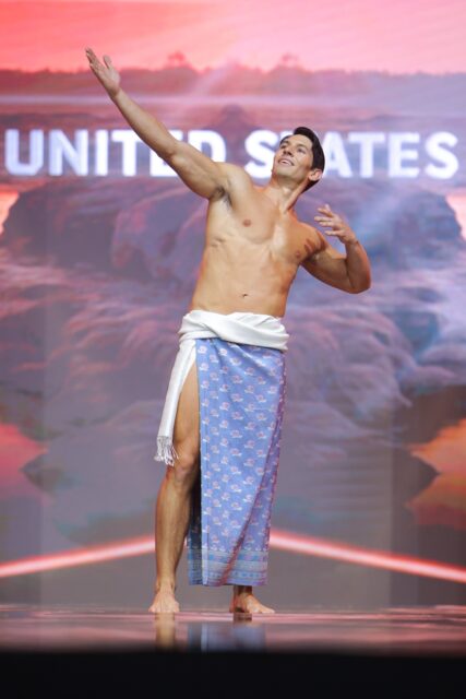 The men of Mister Global 2025 walk the stage in traditional Thai attire.