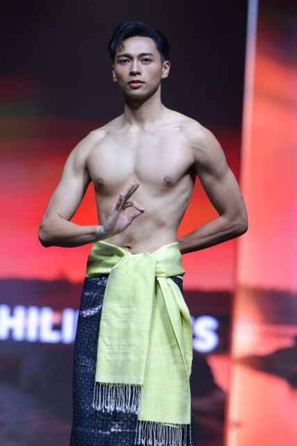 The men of Mister Global 2025 walk the stage in traditional Thai attire.