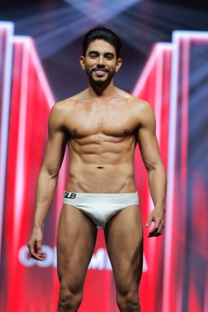 The men of Mister Global 2025 walk the stage for the swimsuit category in Thailand.