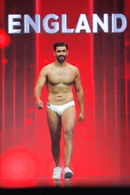 The men of Mister Global 2025 walk the stage for the swimsuit category in Thailand.