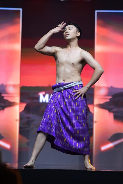 The men of Mister Global 2025 walk the stage in traditional Thai attire.