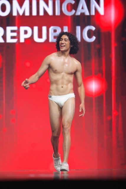 The men of Mister Global 2025 walk the stage for the swimsuit category in Thailand.