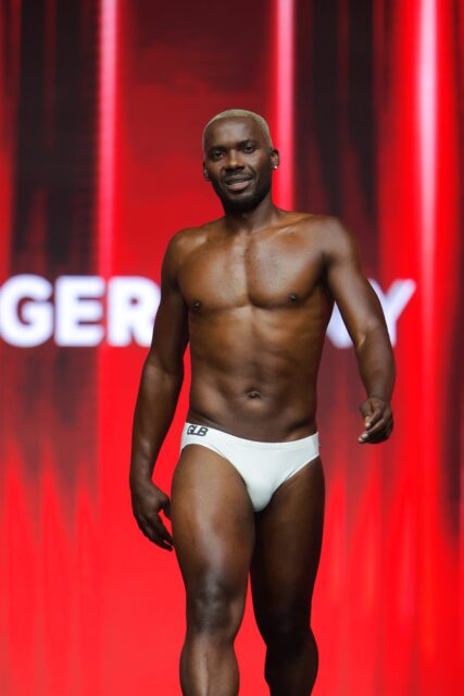 The men of Mister Global 2025 walk the stage for the swimsuit category in Thailand.