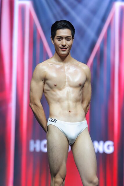 The men of Mister Global 2025 walk the stage for the swimsuit category in Thailand.