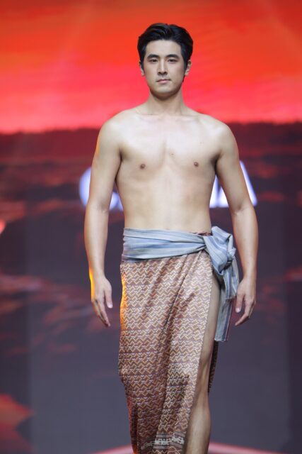The men of Mister Global 2025 walk the stage in traditional Thai attire.