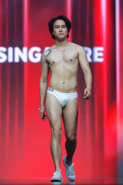 The men of Mister Global 2025 walk the stage for the swimsuit category in Thailand.