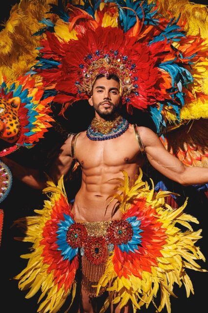 The men of Mister Global 2025 dressed in costume celebrating their unique cultural heritage.
