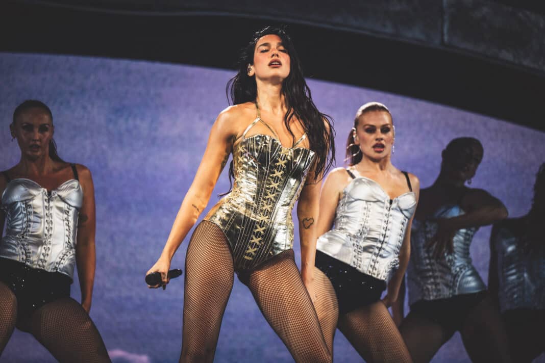 Dua Lipa kicked off the first night of her four-night Radical Optimism takeover at The Forum, delivering a confident and electrifying start to her LA residency. Photo: Kia Forum/Timothy Norris