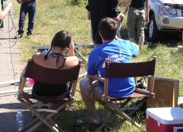 Dan Murphy and Aubrey Plaza as young adults working on a school film. 