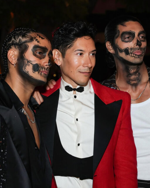 Michael Cimino and Taylor Zakhar Perez turn heads in skeleton makeup at Carlos Eric Lopez’s Día de Muertos Gala, blending glamour and spooky style.