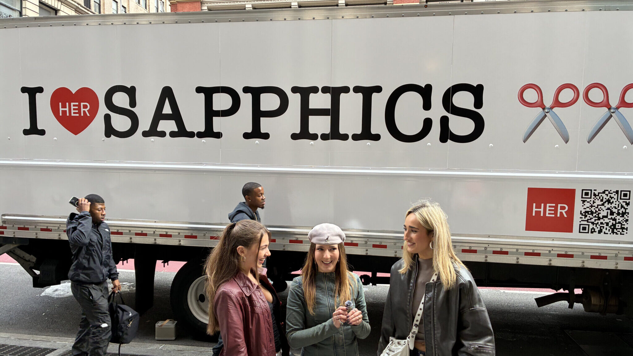 HER app’s sapphic moving truck rolls through NYC, helping queer couples move in and celebrate love in real life.