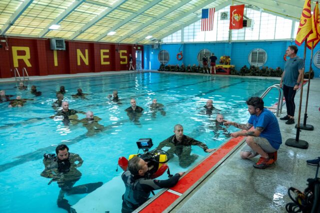 BOOTS. (L to R) Liam Oh as Ray McAffey, Miles Heizer as Cameron Cope, and Director Silas Howard (104, 105) behind the scenes of Episode 104 of Boots. Cr. Patti Perret/Netflix © 2024